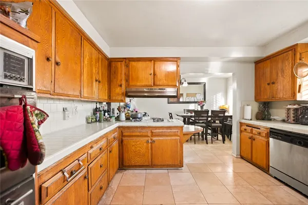 a kitchen with lots of counter top space and appliances