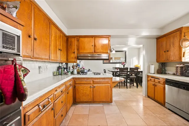 a kitchen with lots of counter top space and appliances