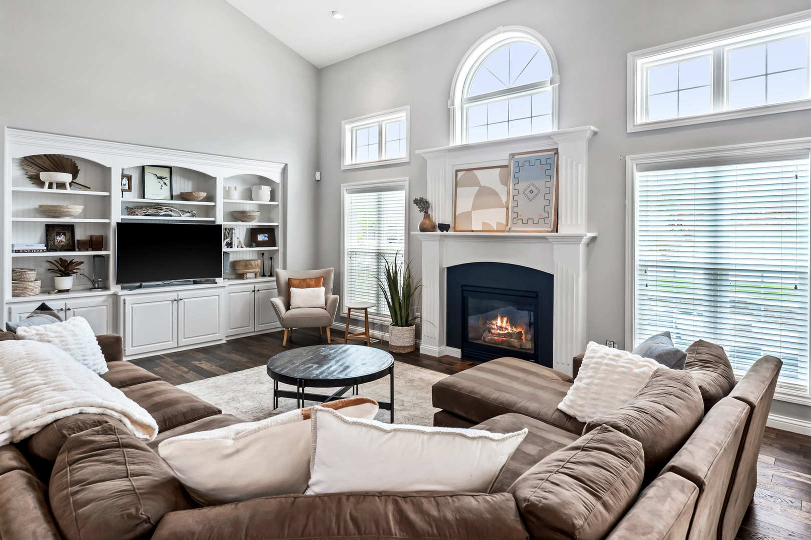 2213 Tyler Trail Bloomington, IL 61705 - Photo 12 of 58 a living room with furniture a fireplace and a flat screen tv