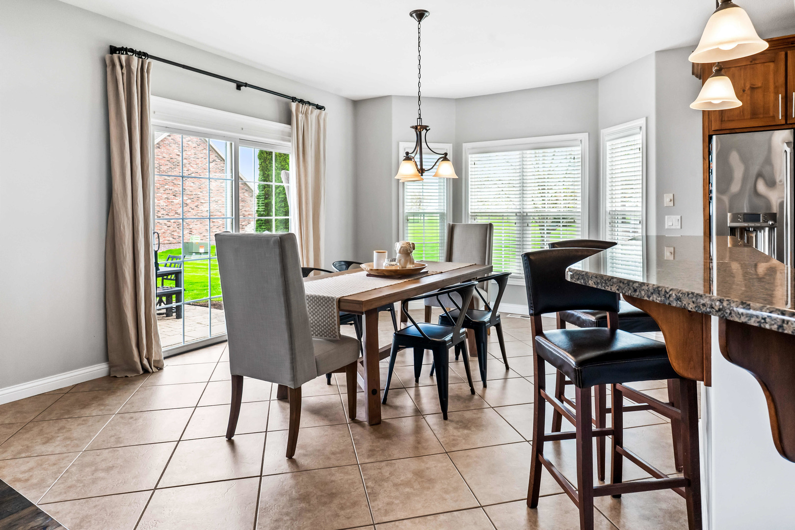 2213 Tyler Trail Bloomington, IL 61705 - Photo 18 of 58 a view of a dining room with furniture window and outside view