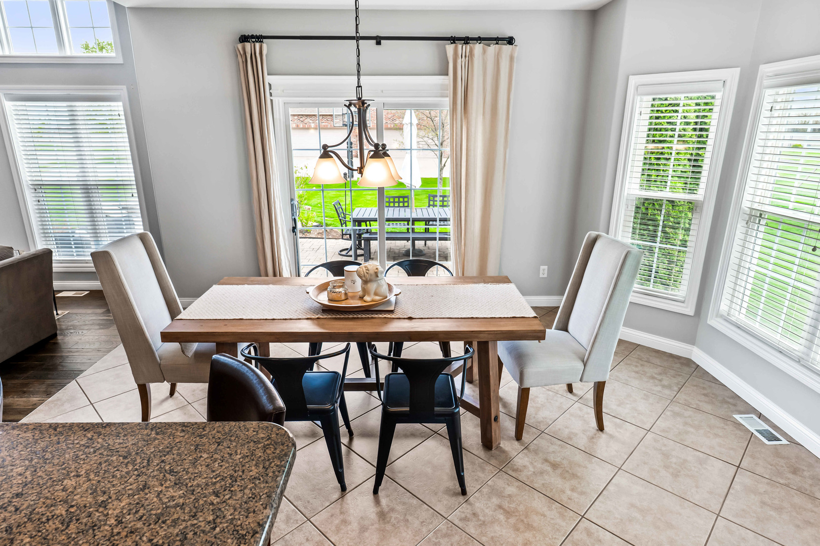 2213 Tyler Trail Bloomington, IL 61705 - Photo 19 of 58 a view of a dining room with furniture window and outside view