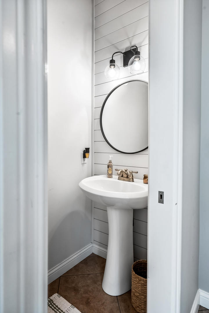 2213 Tyler Trail Bloomington, IL 61705 - Photo 22 of 58 a bathroom with a sink and a mirror
