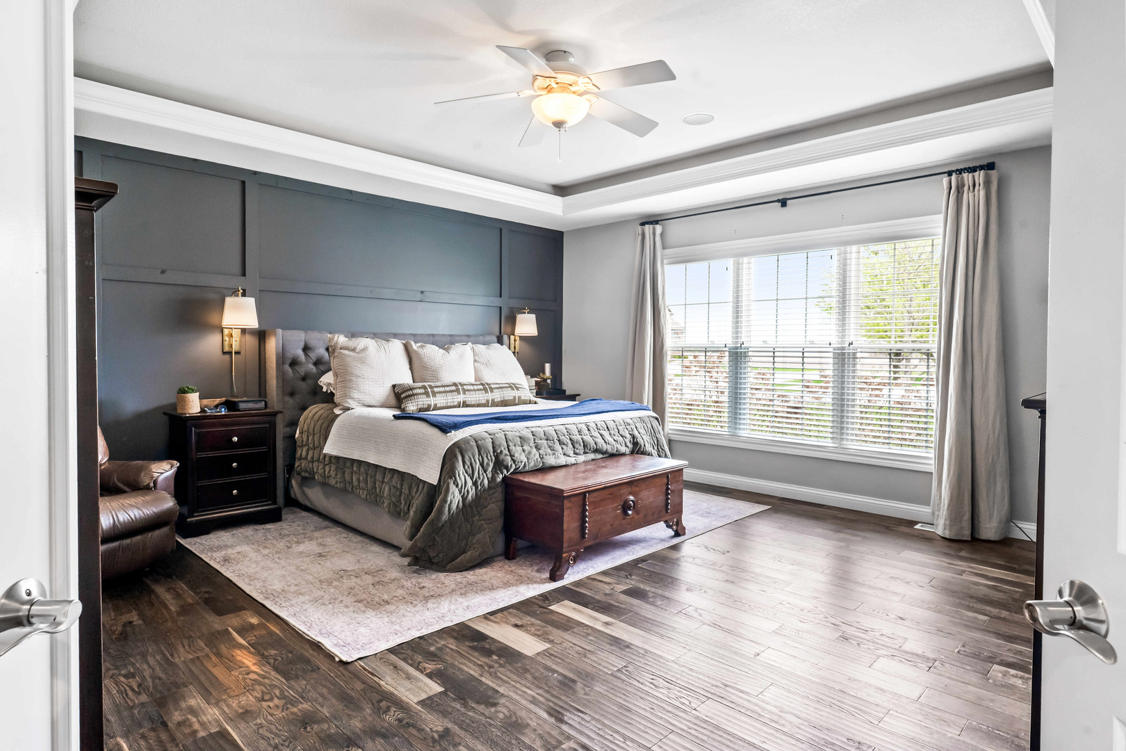 2213 Tyler Trail Bloomington, IL 61705 - Photo 23 of 58 a bedroom with a large bed and a chandelier