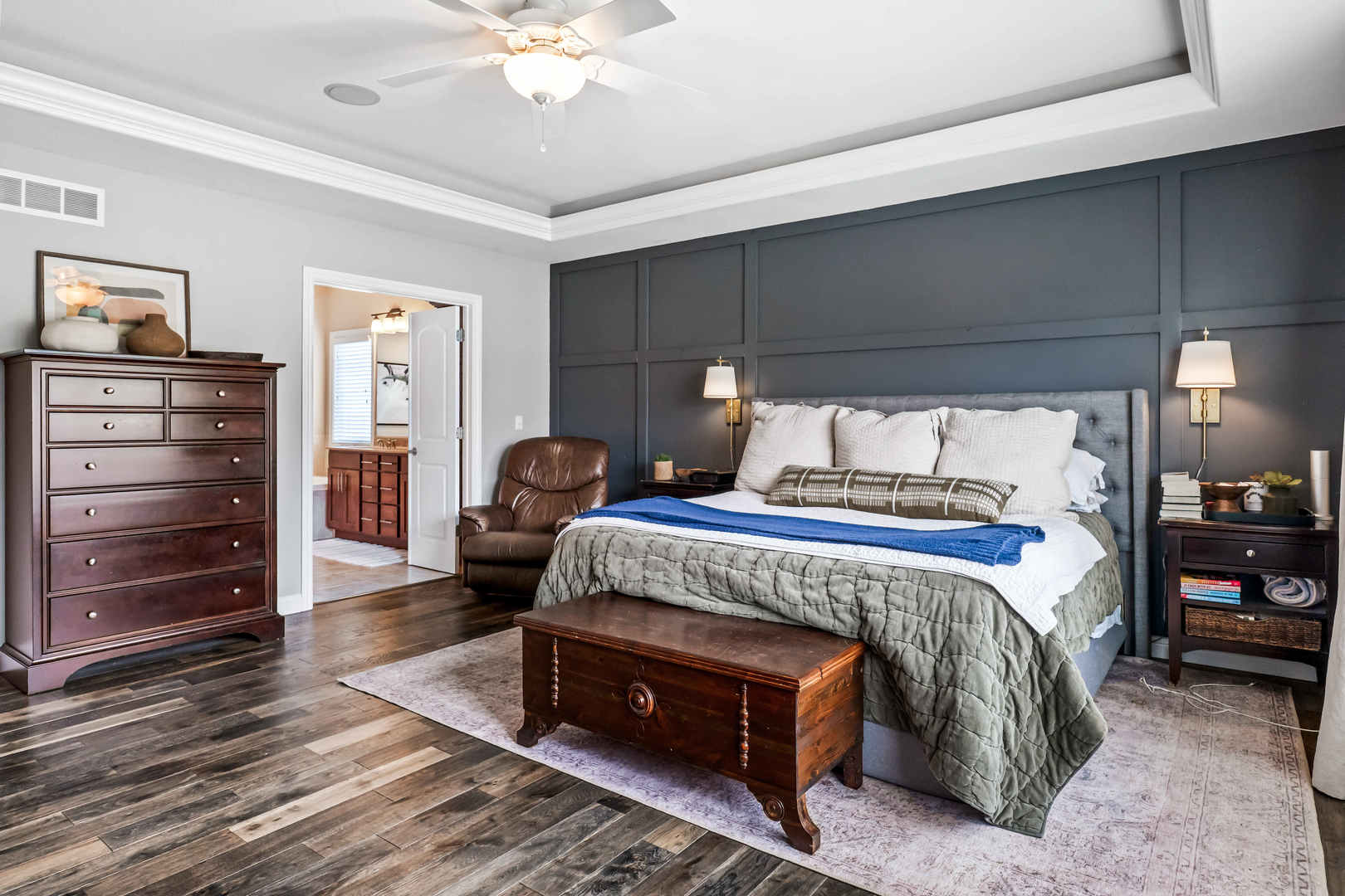 2213 Tyler Trail Bloomington, IL 61705 - Photo 24 of 58 a bedroom with a bed a dresser and a chandelier