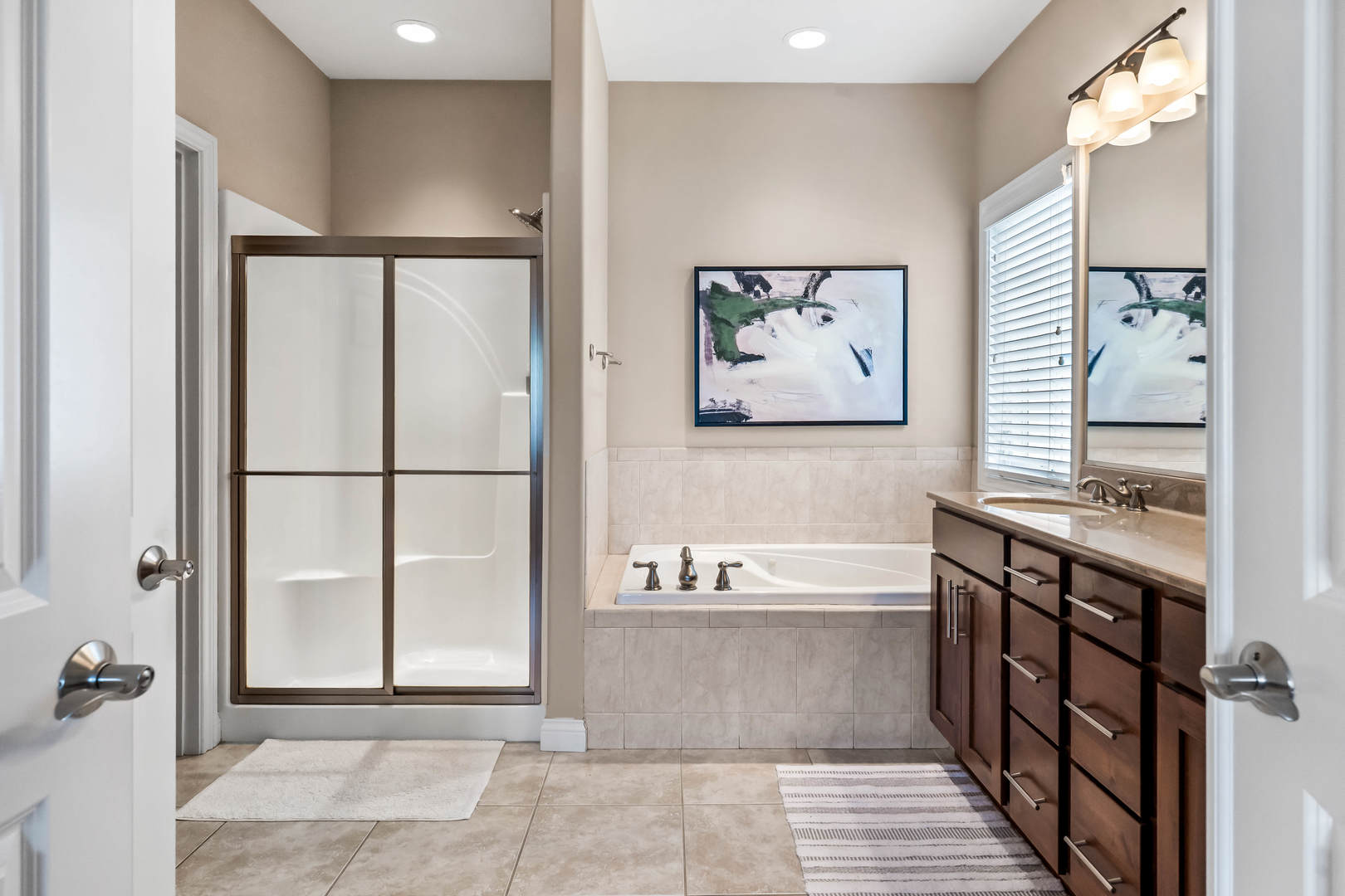 2213 Tyler Trail Bloomington, IL 61705 - Photo 27 of 58 a bathroom with a bathtub and a shower