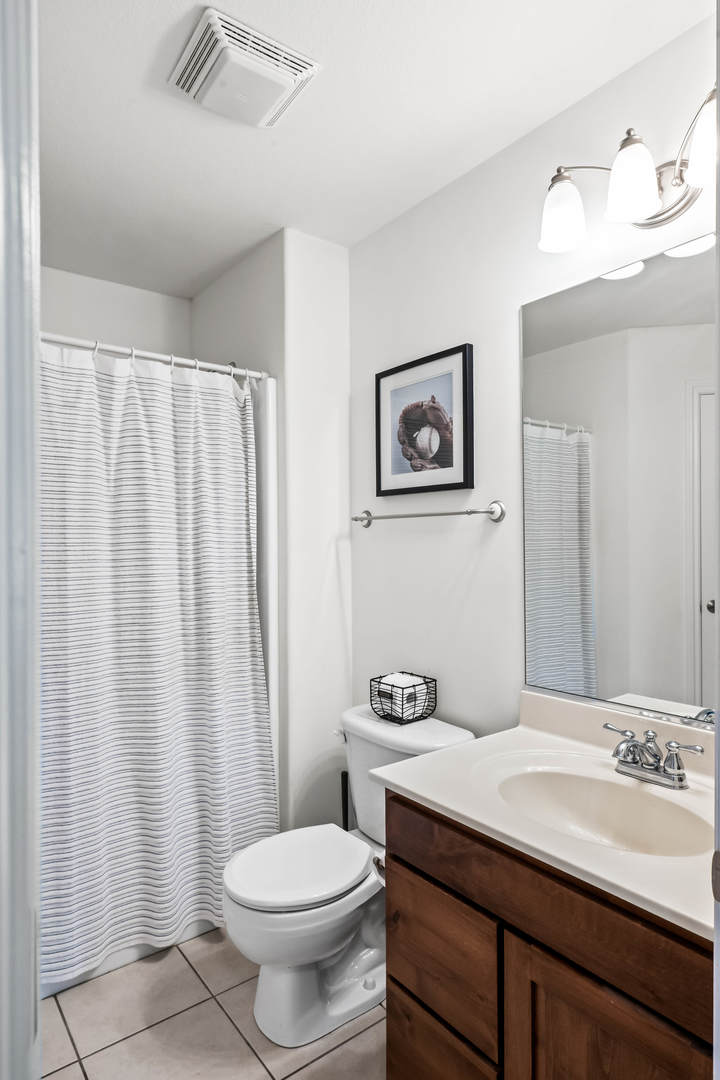 2213 Tyler Trail Bloomington, IL 61705 - Photo 35 of 58 a bathroom with a sink a toilet and shower curtain