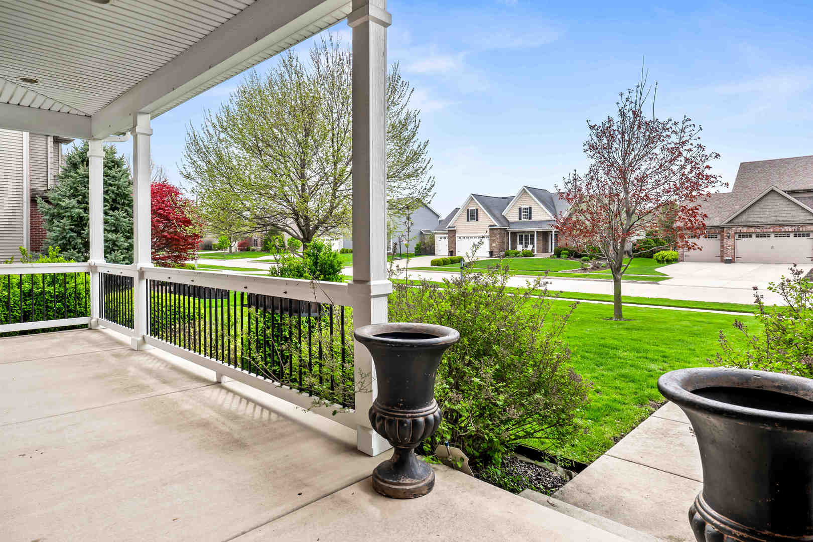 2213 Tyler Trail Bloomington, IL 61705 - Photo 5 of 58 a view of a garden with a fountain and a garden