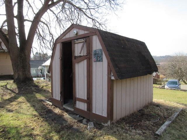 213 Stone Church Road Grindstone, PA 15442 - Photo 6 of 19 a front view of a house with garden