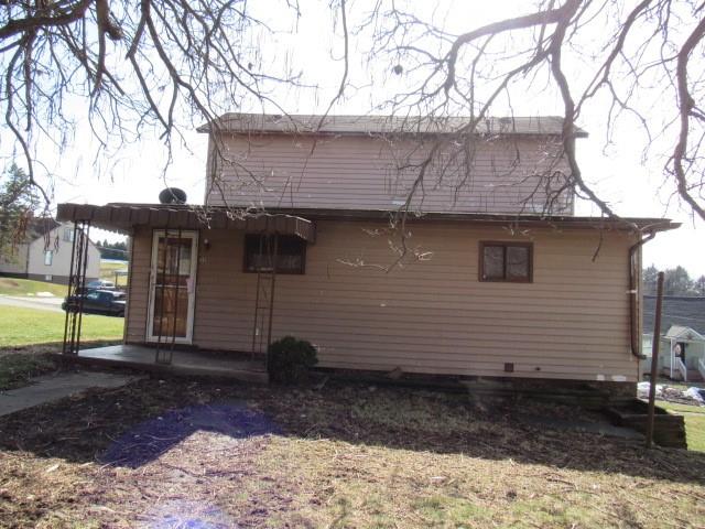213 Stone Church Road Grindstone, PA 15442 - Photo 7 of 19 a view of a house with a backyard