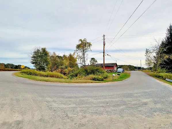 a view of a road with an ocean view