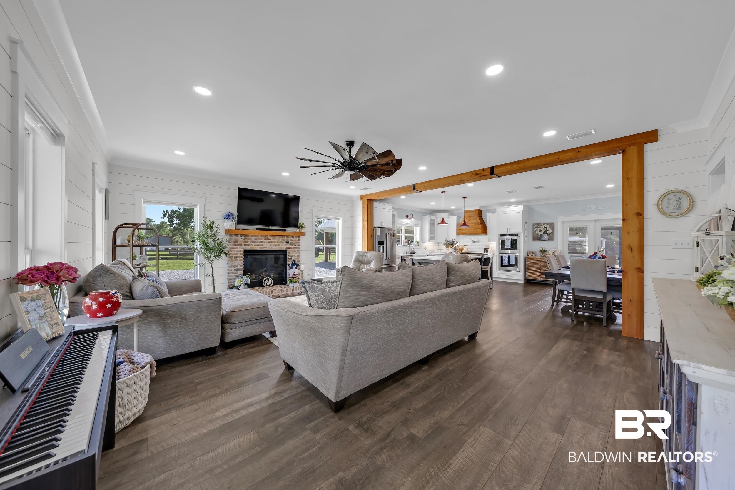 6576 Ranch Loop Road East Grand Bay, AL 36541 - Photo 9 of 39 Spacious living area featuring wood-finish flooring, recessed lighting, and white shiplap walls