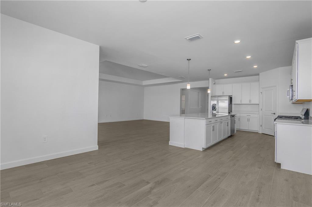 21094 Verawood Loop Estero, FL 33928 - Photo 14 of 49 a view of kitchen with furniture and refrigerator