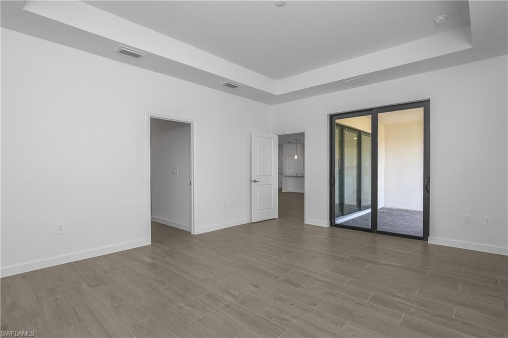 21094 Verawood Loop Estero, FL 33928 - Photo 23 of 49 a view of an empty room with glass door