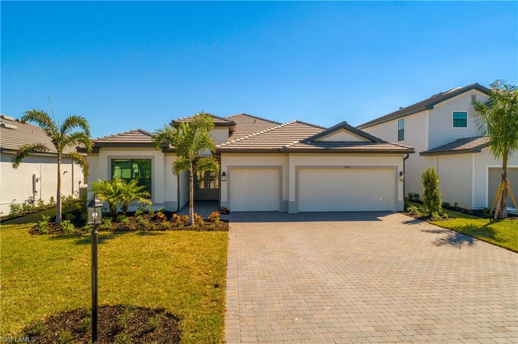 21094 Verawood Loop Estero, FL 33928 - Photo 36 of 49 a front view of house with yard and seating area