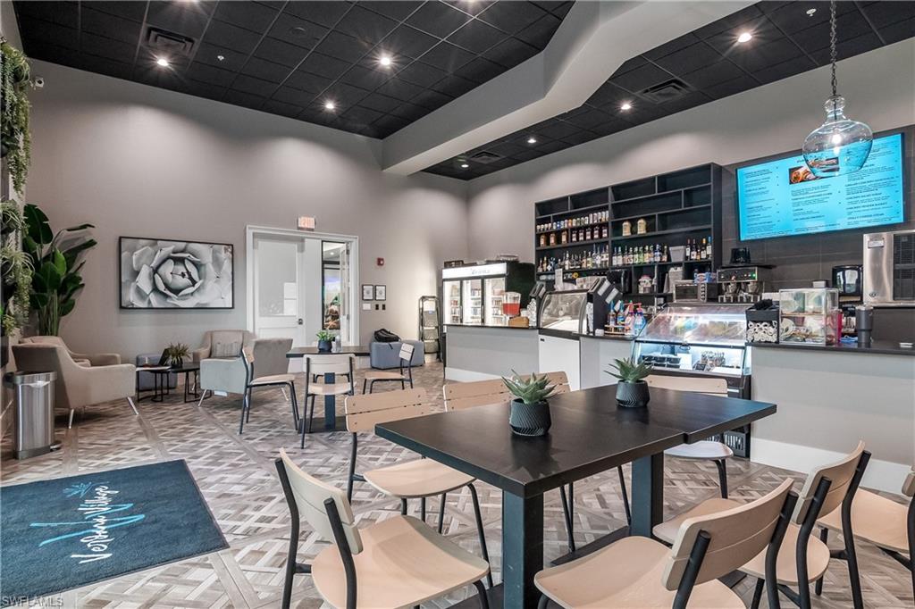 21094 Verawood Loop Estero, FL 33928 - Photo 41 of 49 a kitchen with a table and chairs