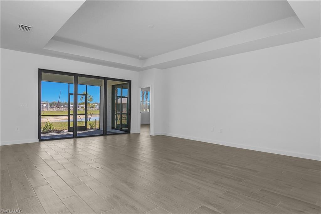 21094 Verawood Loop Estero, FL 33928 - Photo 47 of 49 a view of an empty room with wooden floor and a window