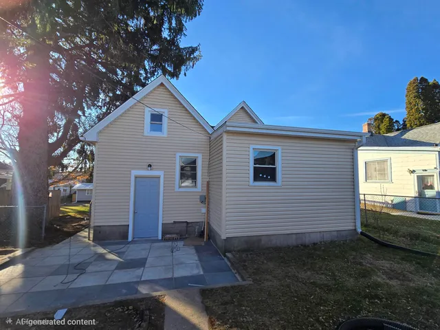 a house view with a backyard space