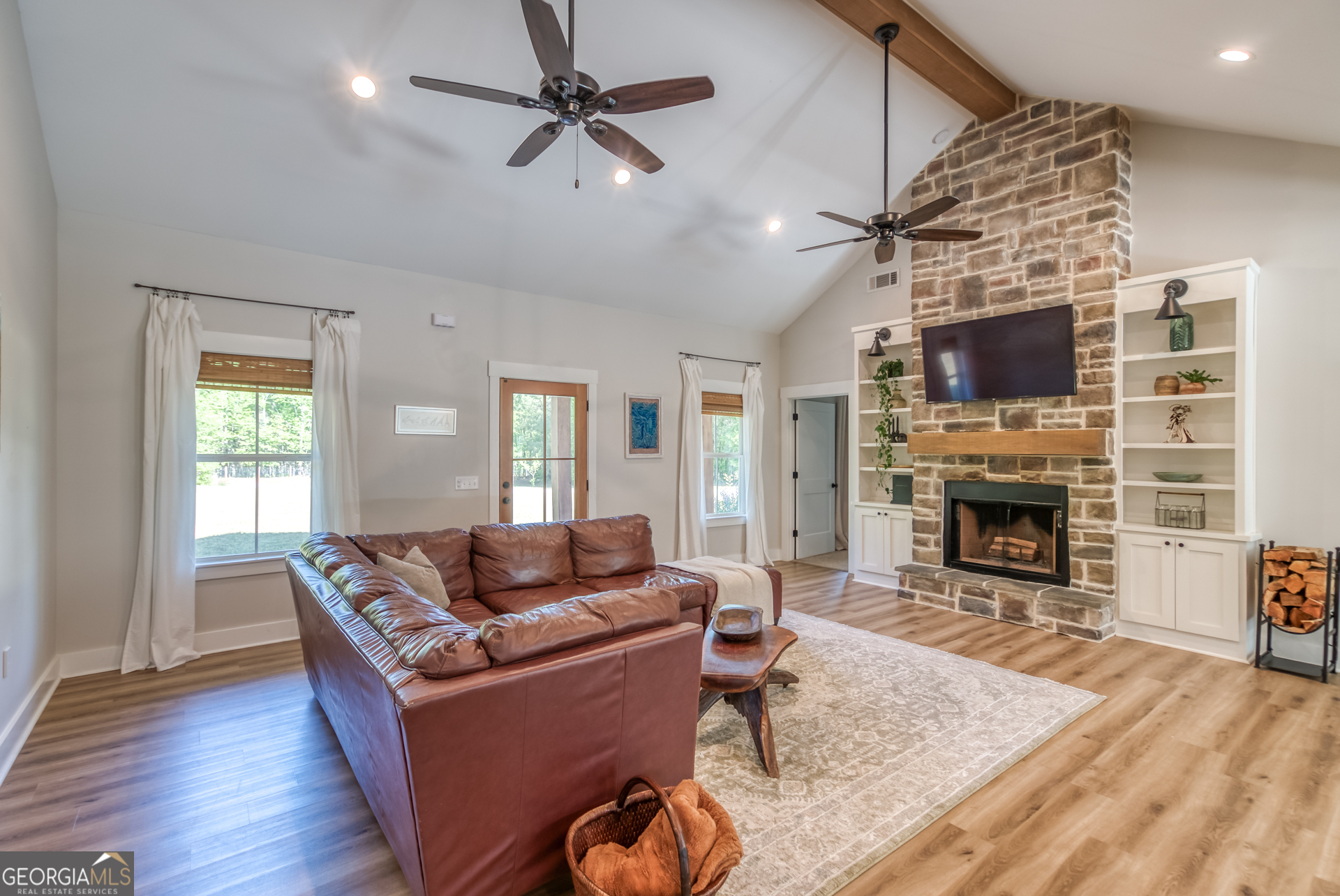 1281 Chilton Woods Road Rutledge, GA 30663 - Photo 12 of 59 a living room with furniture and a fireplace