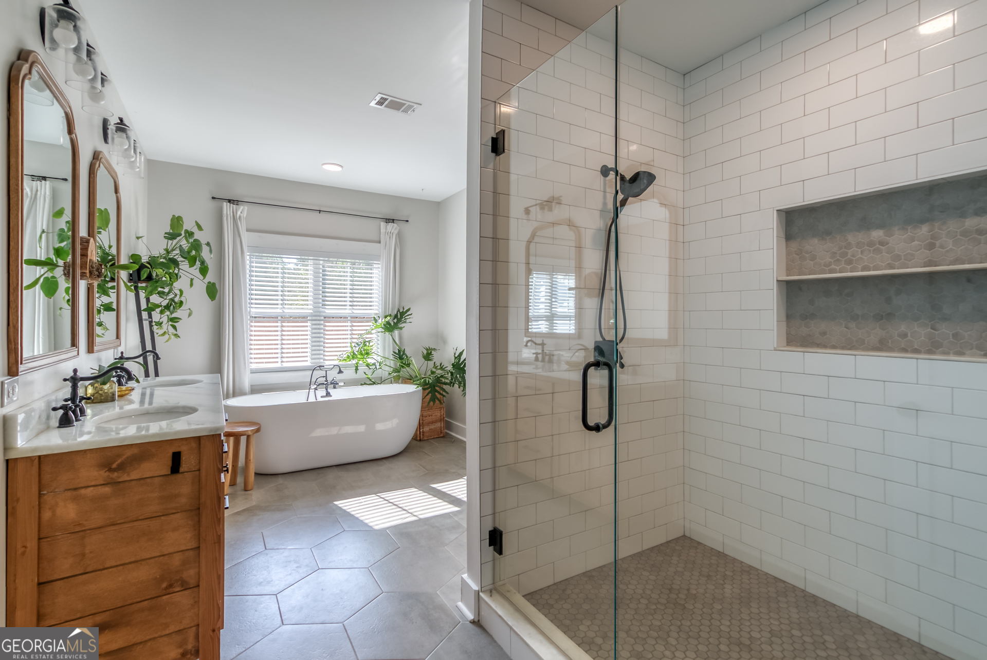 1281 Chilton Woods Road Rutledge, GA 30663 - Photo 32 of 59 a bathroom with a tub sink and mirror
