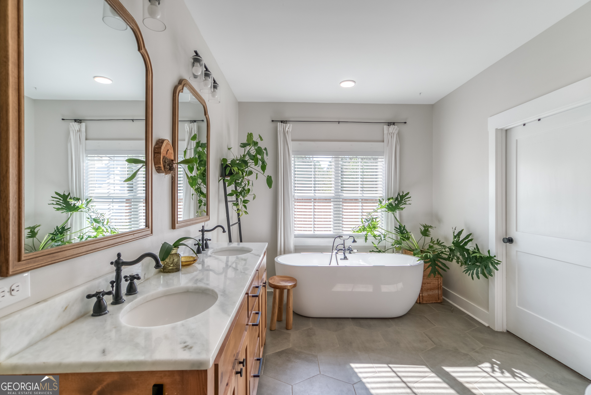 1281 Chilton Woods Road Rutledge, GA 30663 - Photo 33 of 59 a spacious bathroom with a bathtub and window