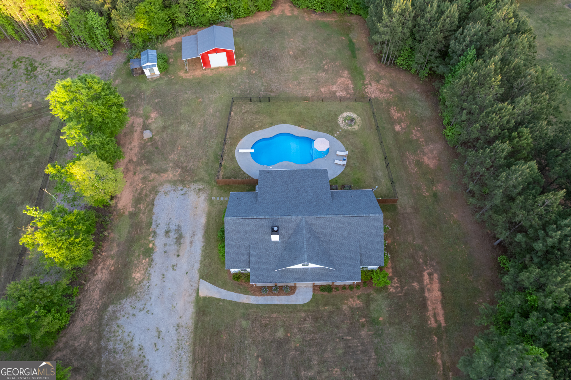 1281 Chilton Woods Road Rutledge, GA 30663 - Photo 4 of 59 an aerial view of a house with a yard and a large tree