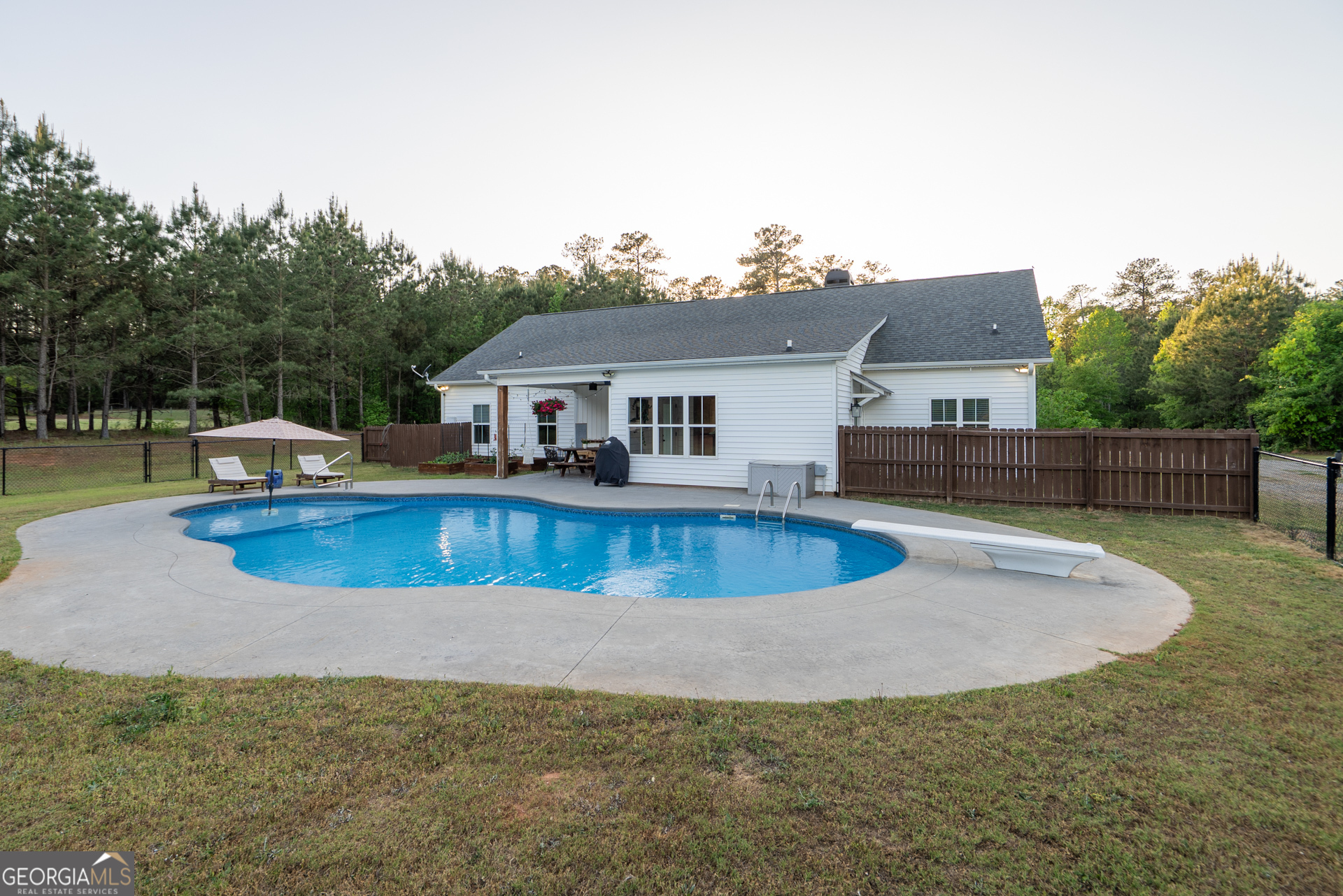 1281 Chilton Woods Road Rutledge, GA 30663 - Photo 54 of 59 a view of a house with swimming pool
