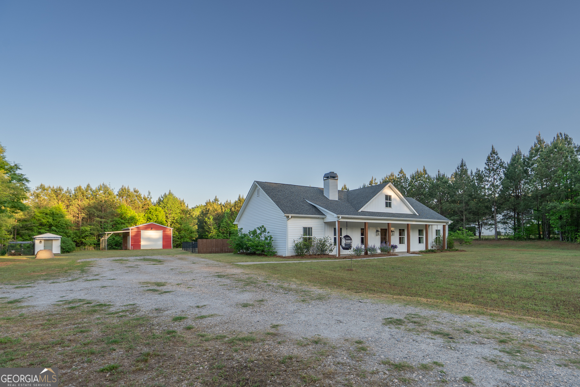 1281 Chilton Woods Road Rutledge, GA 30663 - Photo 6 of 59 a front view of a house with a yard and trees
