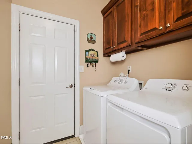 a view of storage and utility room with washer and dryer