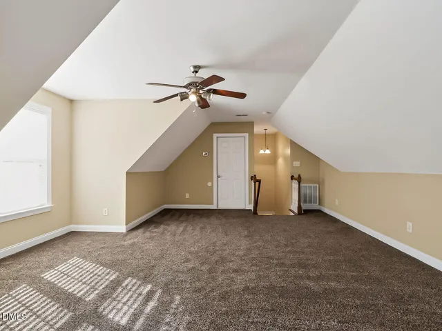 a view of an empty room with windows