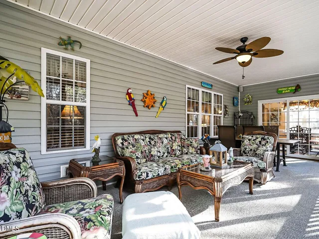 a outdoor space with patio the couches and a dining table with the potted plants