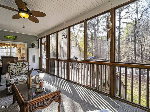 a view of a balcony with furniture