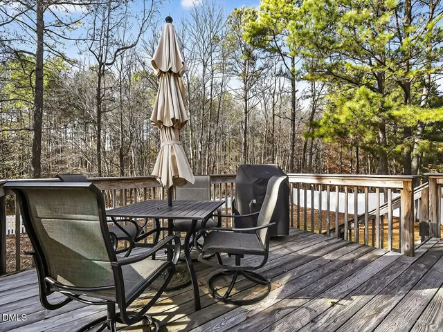 a view of a chairs and table on the deck