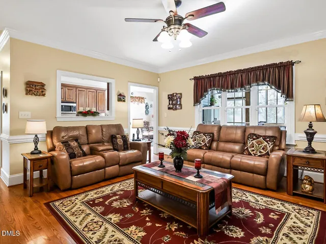 a living room with furniture and a rug
