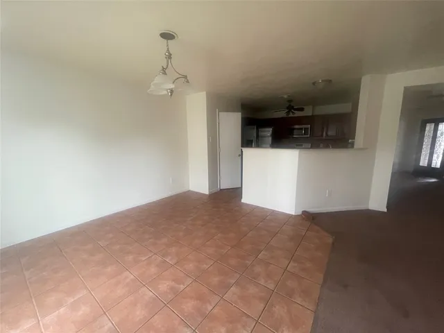 a bedroom with a bed and a television in it