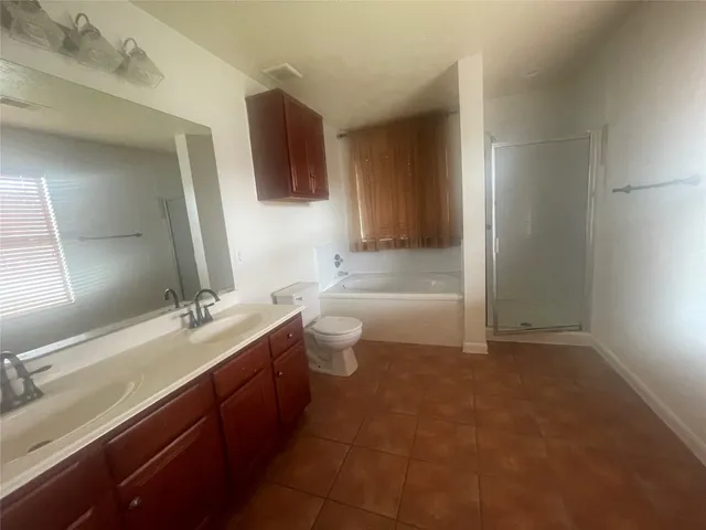 a bathroom with a double vanity sink and mirror