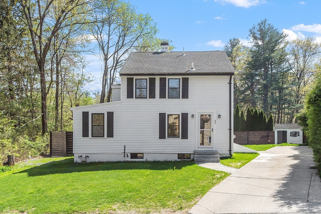 43 Public Road Lancaster, MA 01523 - Photo 1 of 31 a front view of a house with a yard
