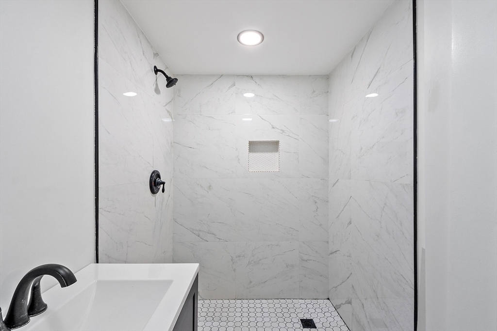 43 Public Road Lancaster, MA 01523 - Photo 13 of 31 a bathroom with a sink and shower