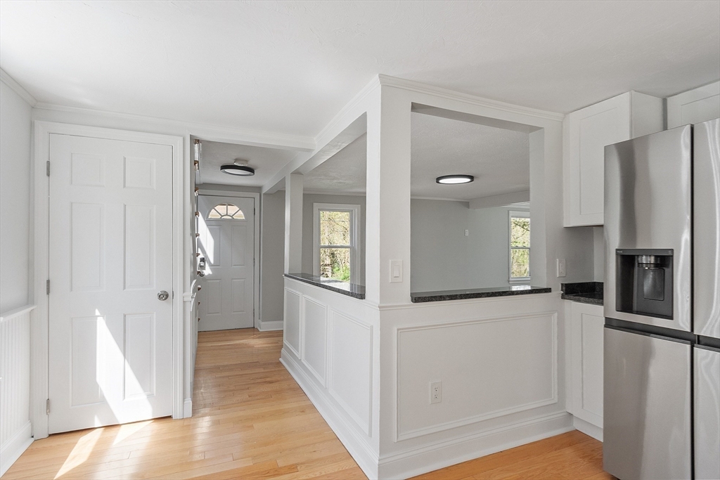 43 Public Road Lancaster, MA 01523 - Photo 14 of 31 a view of a kitchen from a hallway