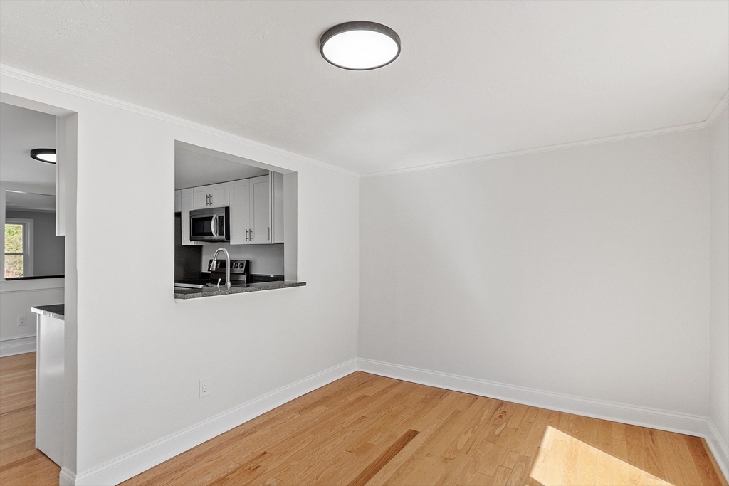 43 Public Road Lancaster, MA 01523 - Photo 16 of 31 a view of a room with wooden floor and window