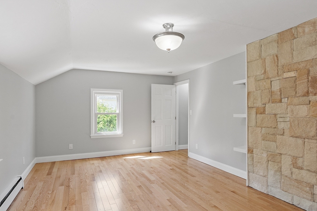 43 Public Road Lancaster, MA 01523 - Photo 19 of 31 an empty room with wooden floor and windows