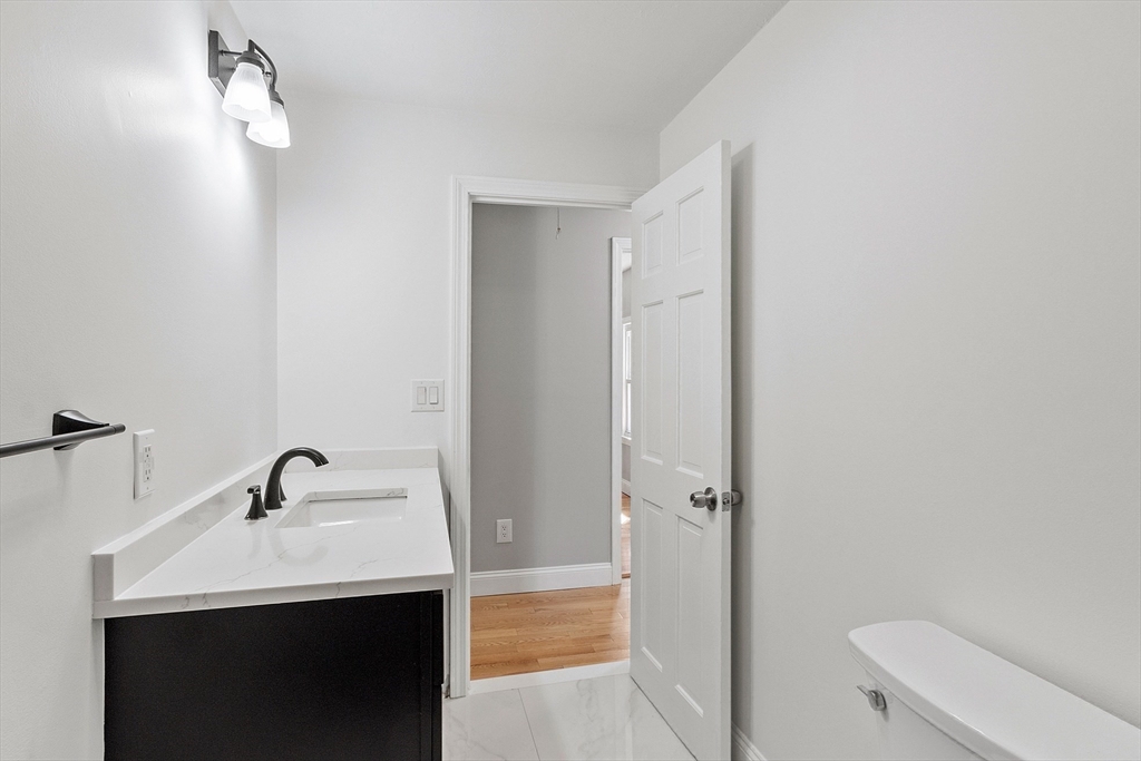 43 Public Road Lancaster, MA 01523 - Photo 22 of 31 a bathroom with a sink a toilet and shower