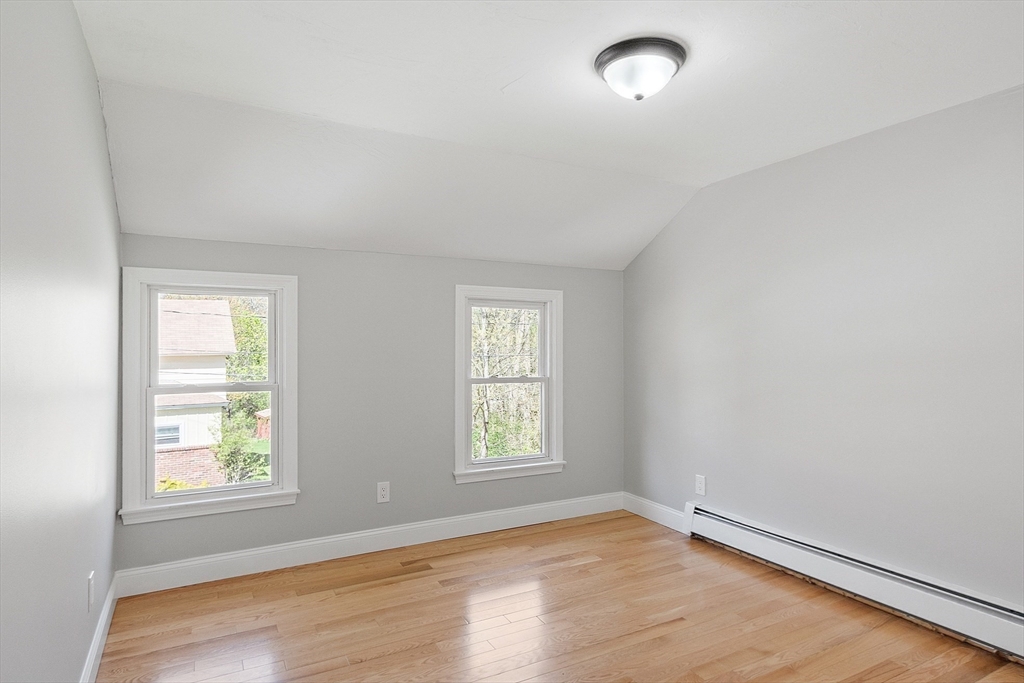 43 Public Road Lancaster, MA 01523 - Photo 23 of 31 an empty room with wooden floor and windows