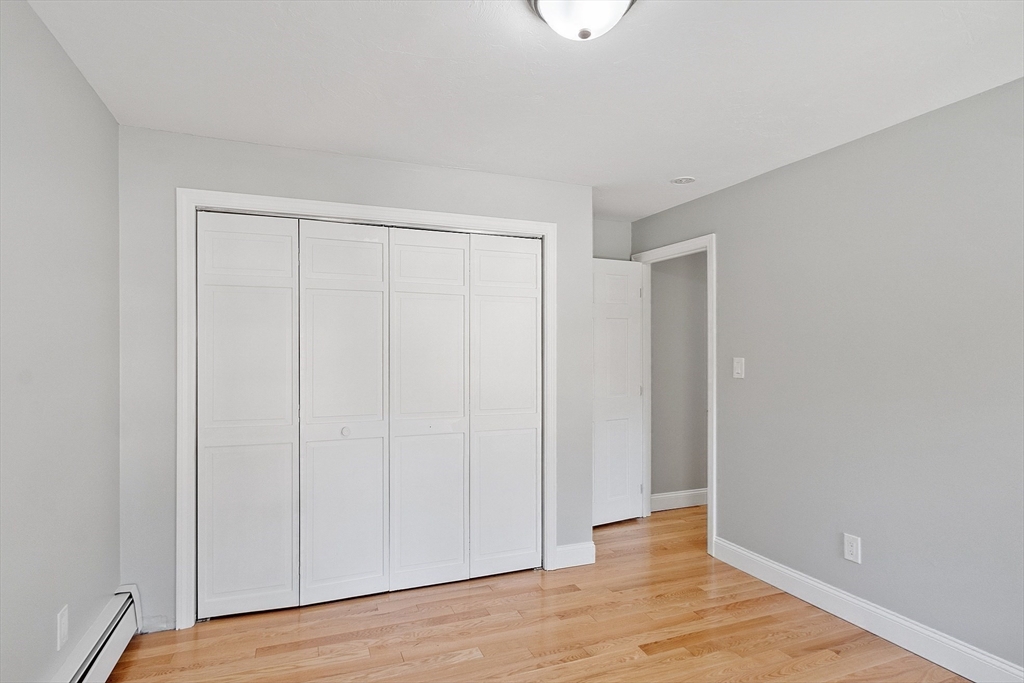 43 Public Road Lancaster, MA 01523 - Photo 24 of 31 a view of an empty room with wooden floor