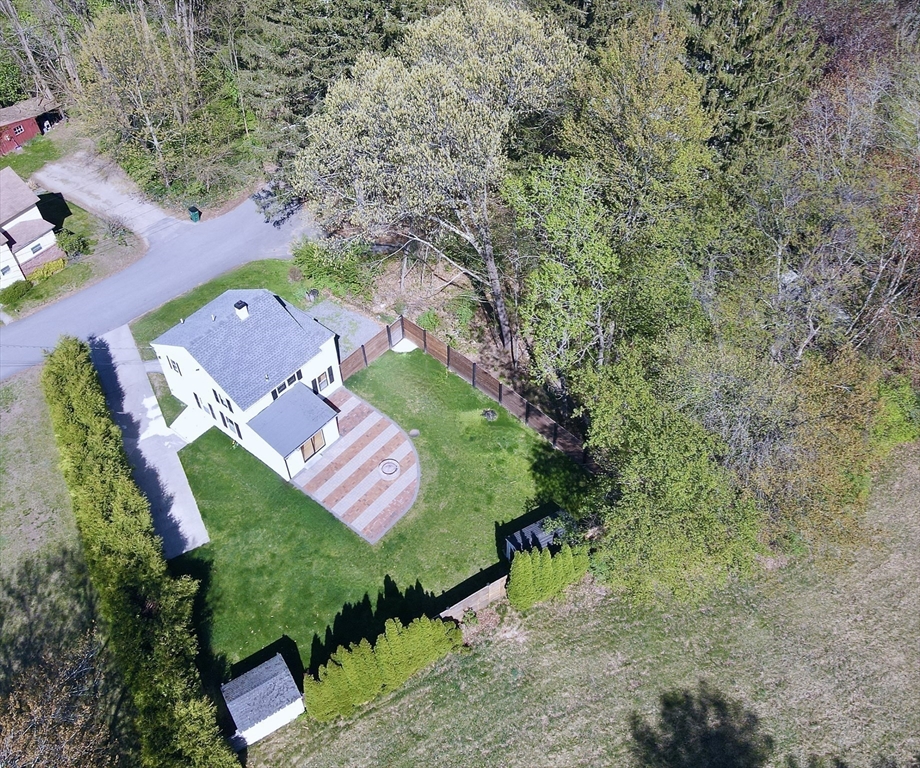 43 Public Road Lancaster, MA 01523 - Photo 30 of 31 an aerial view of a house with a yard and greenery