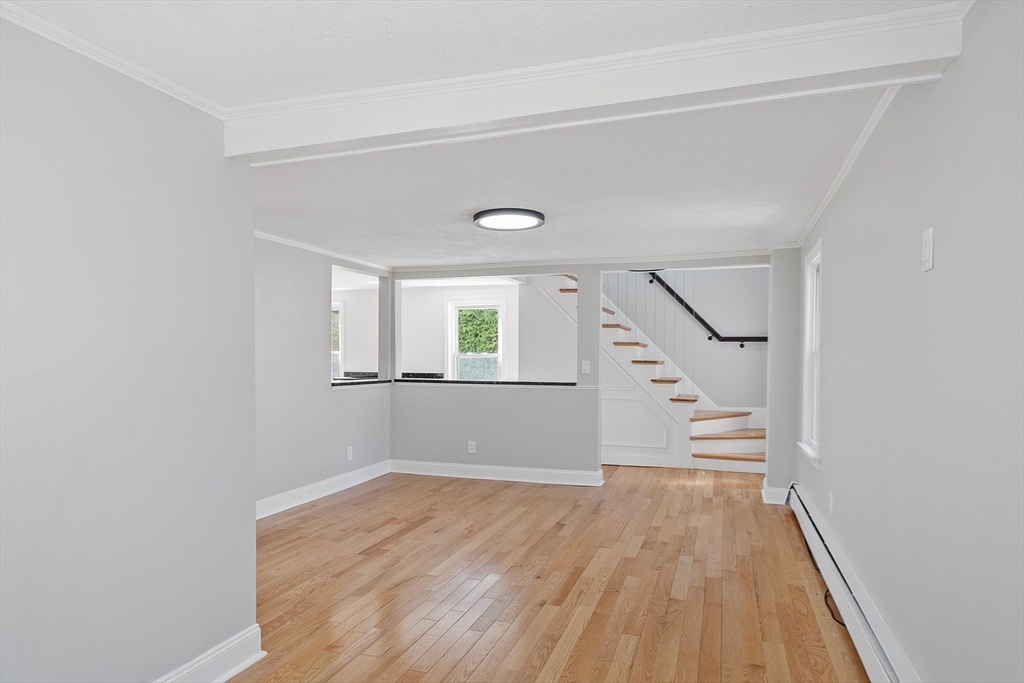 43 Public Road Lancaster, MA 01523 - Photo 8 of 31 wooden floor in an empty room with a window
