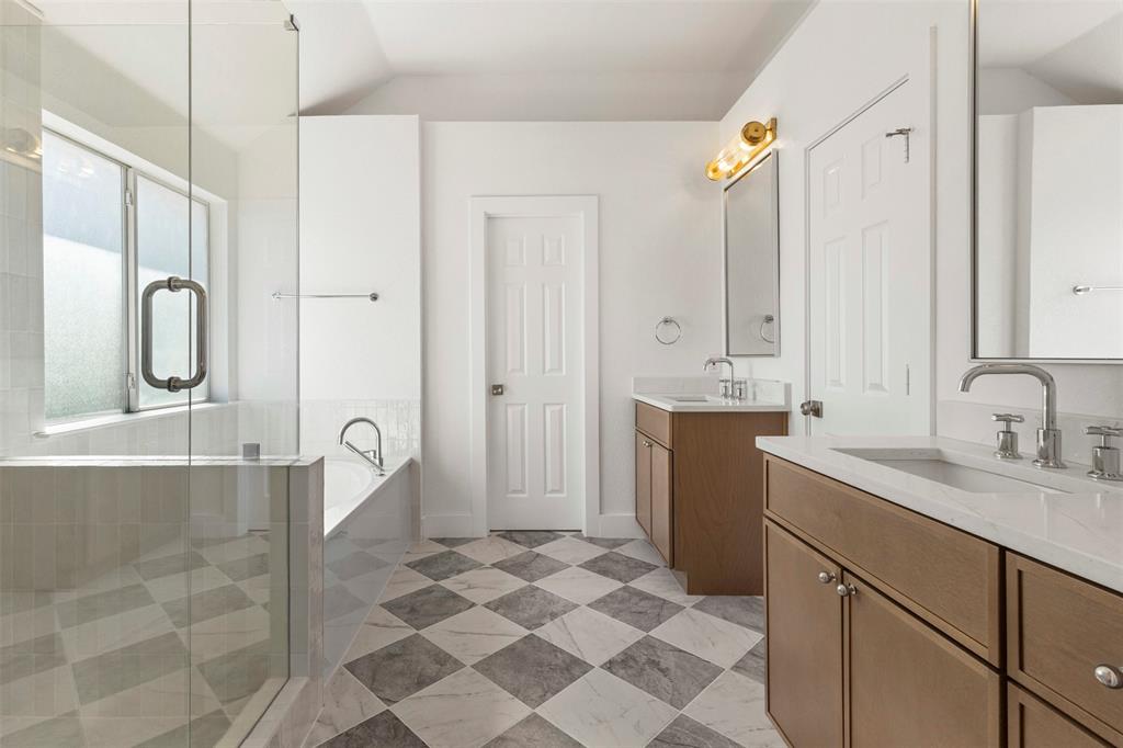 421 Ridge Meade Drive Lewisville, TX 75067 - Photo 2 of 36 a bathroom with a double vanity sink mirror and shower