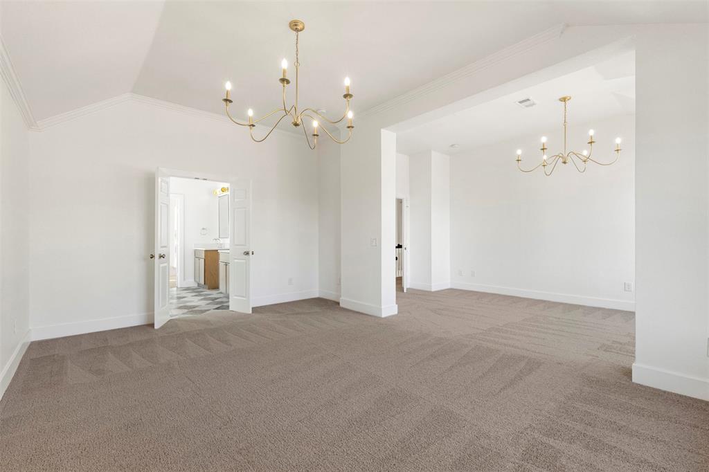 421 Ridge Meade Drive Lewisville, TX 75067 - Photo 22 of 36 a view of a chandelier in big room and chandelier