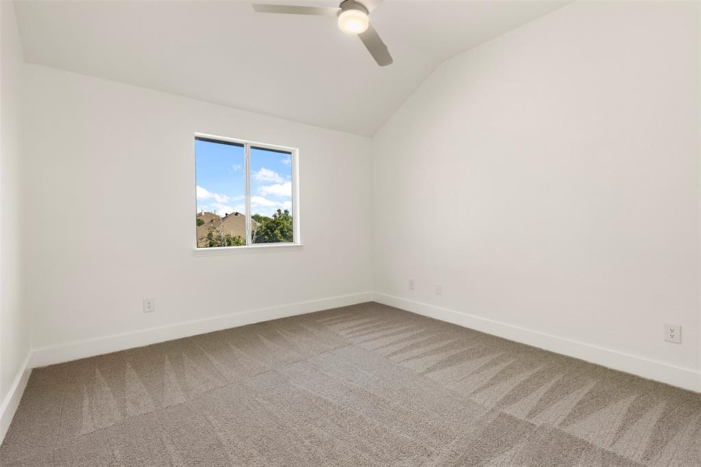 421 Ridge Meade Drive Lewisville, TX 75067 - Photo 24 of 36 an empty room with a window