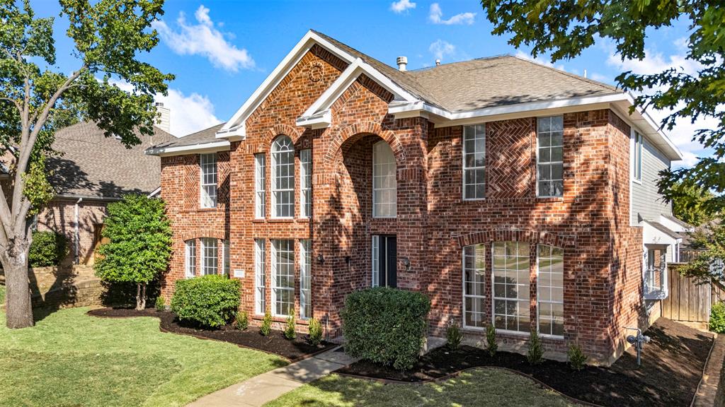 421 Ridge Meade Drive Lewisville, TX 75067 - Photo 33 of 36 front view of a house with a yard