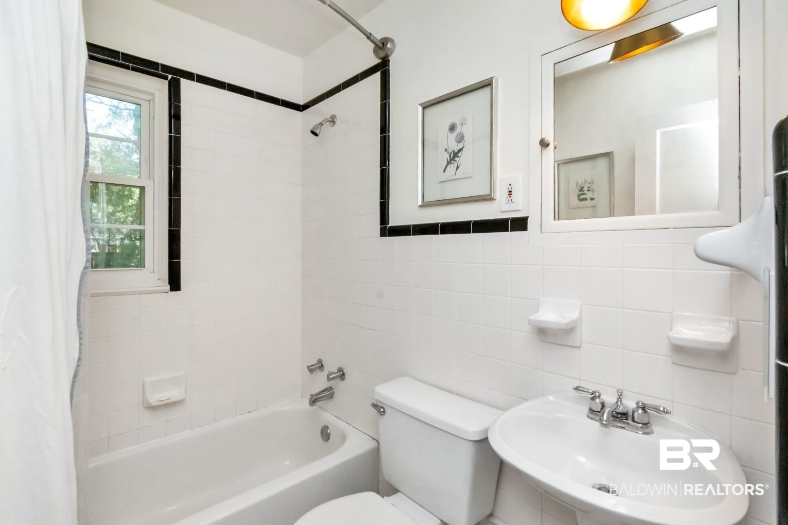 18 Princess Anne Road Mobile, AL 36608 - Photo 28 of 41 Bathroom with shower / tub combo, tile walls, and backsplash
